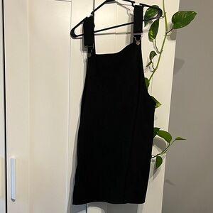 Black Women’s overall mini dress. 

Unique and fun style!
